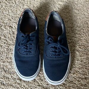 Navy blue vans with leather tongue